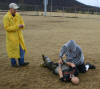 Applicant cuffs a dummy as part of his Physical Agility Test