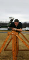 Applicant jumps a wall during his Physical Agility Test