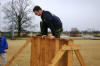 Applicant jumps a wall during his Physical Agility Test